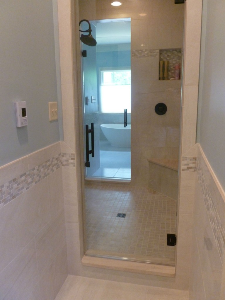 THIS LARGE SHOWER HAS 2 SHOWER DOORS FOR HIS/HERS BATHROOMS.  STYLISH LADDER HANDLE IN OIL RUBBED BRONZE  FINISH.  PROJECT WAS IN THE TARRINGTON SUBDIVISION / MIDLOTHIAN VA