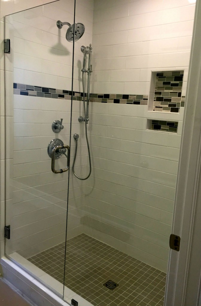 THIS FRAMELESS GLASS SHOWER ENCLOSURE HAS SHOWERGUARD GLASS WHICH KEEPS THE GLASS CLEAN FOR A LIFETIME.